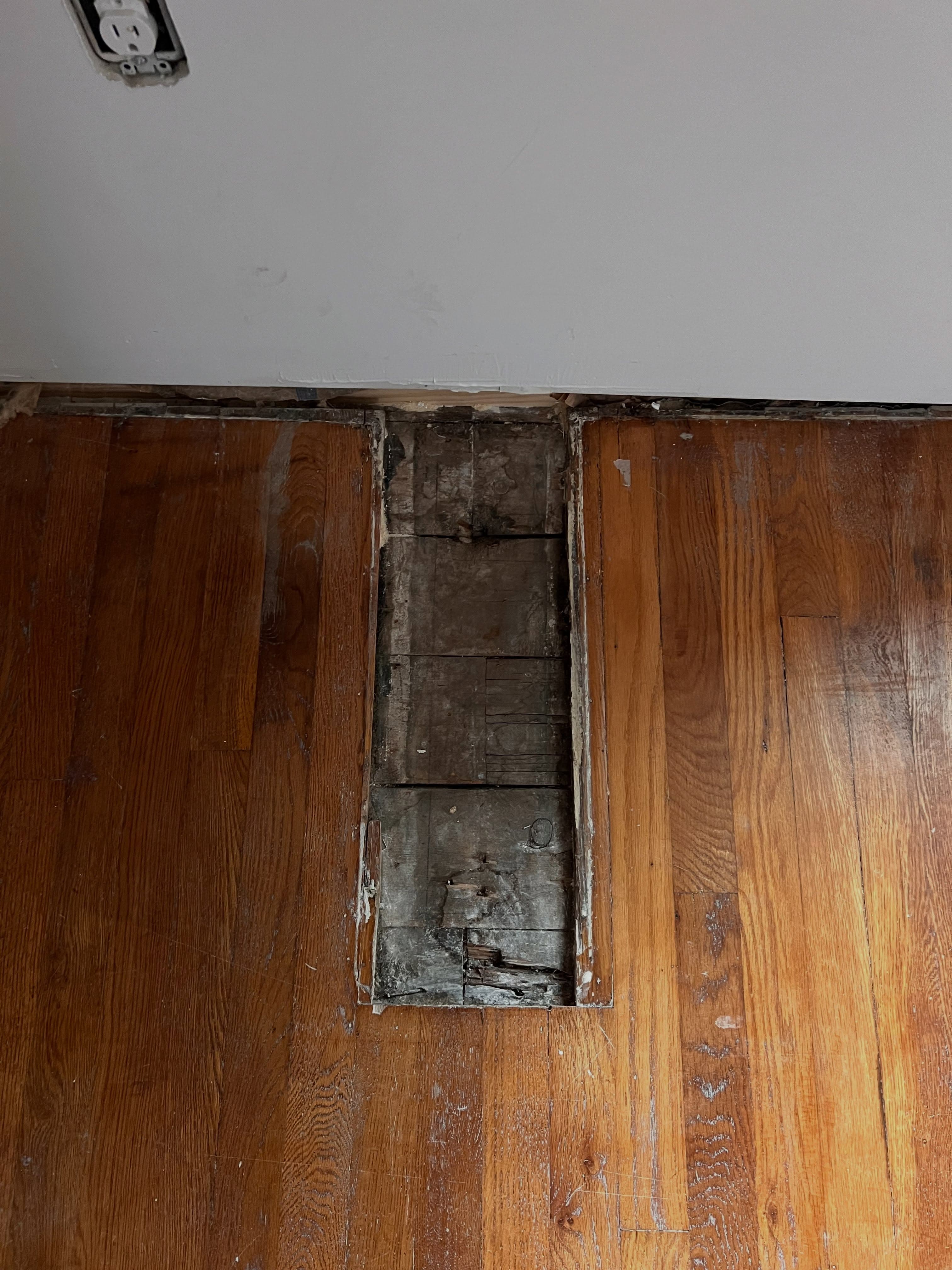 Flooring transition work in progress, hardwood meets subfloor